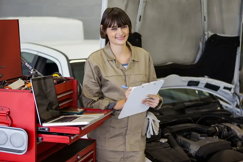 portrait female mechanic preparing check list web