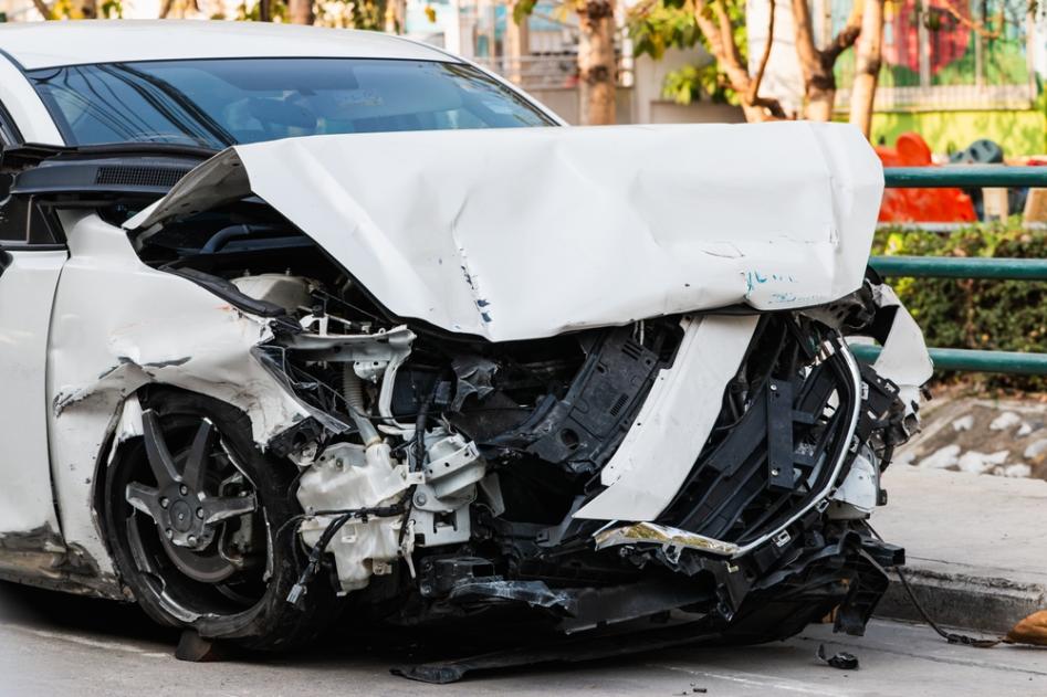Car with severe structural damage after a front-end collision