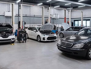 Busy body shop floor showing how workshop capacity affects collision repair cycle time