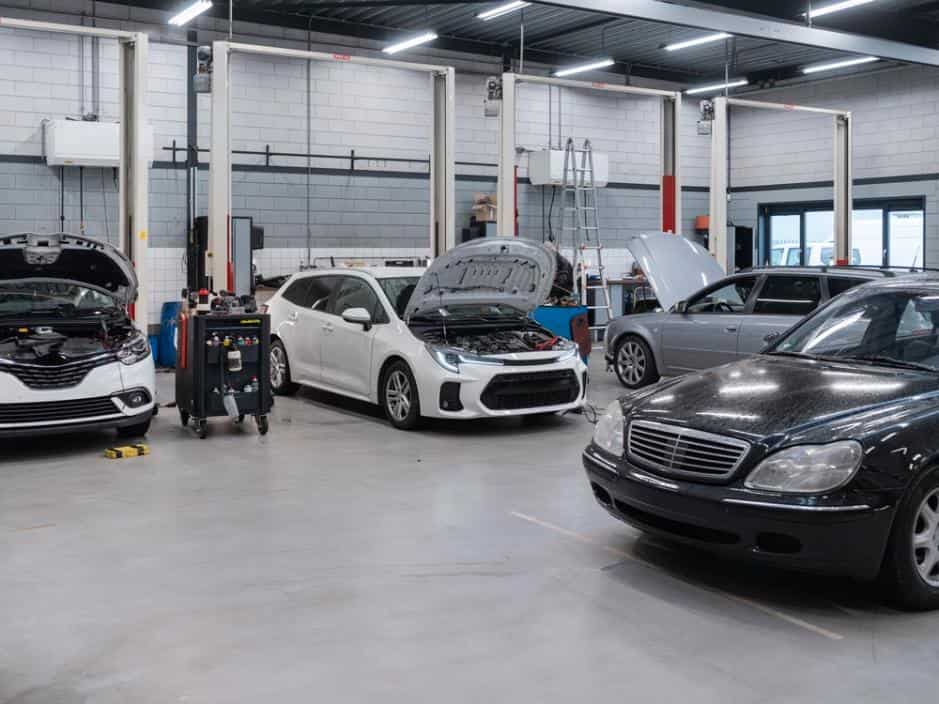 Busy body shop floor showing how workshop capacity affects collision repair cycle time