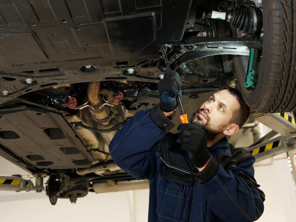 Technician verifying structural repair accuracy to reduce collision repair cycle time