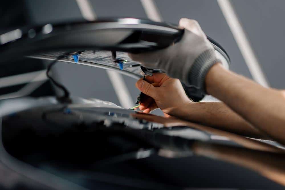 Technician fitting a body part, a skill covered under I-CAR certification training